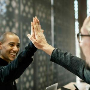Colleagues giving a high five
